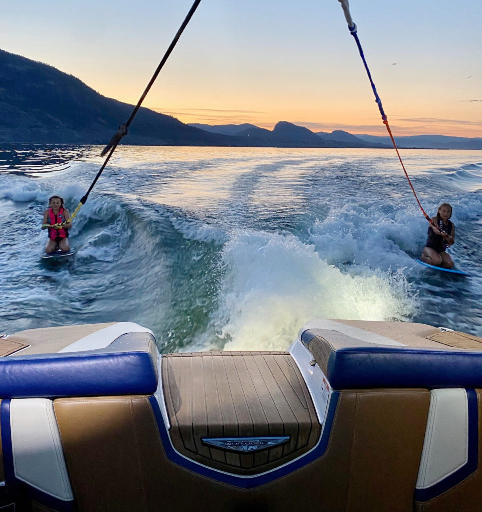 Two girls wakeboarding on okanagan lake in Penticton